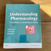 Pharmacology book (Understanding Pharmacology) with study guide. 2 books