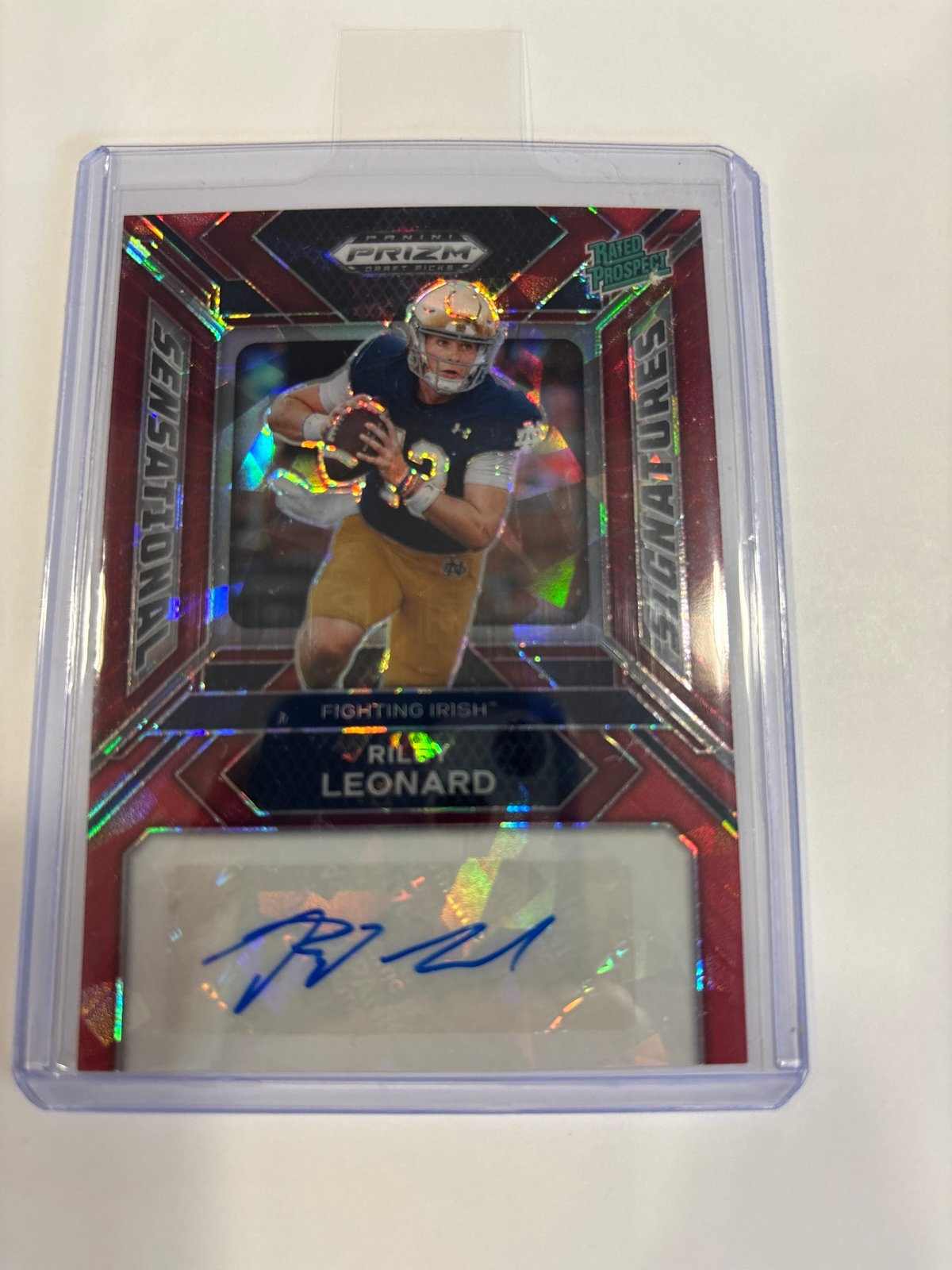 Riley Leonard prizm sensational signatures red cracked ice rated rookie auto.