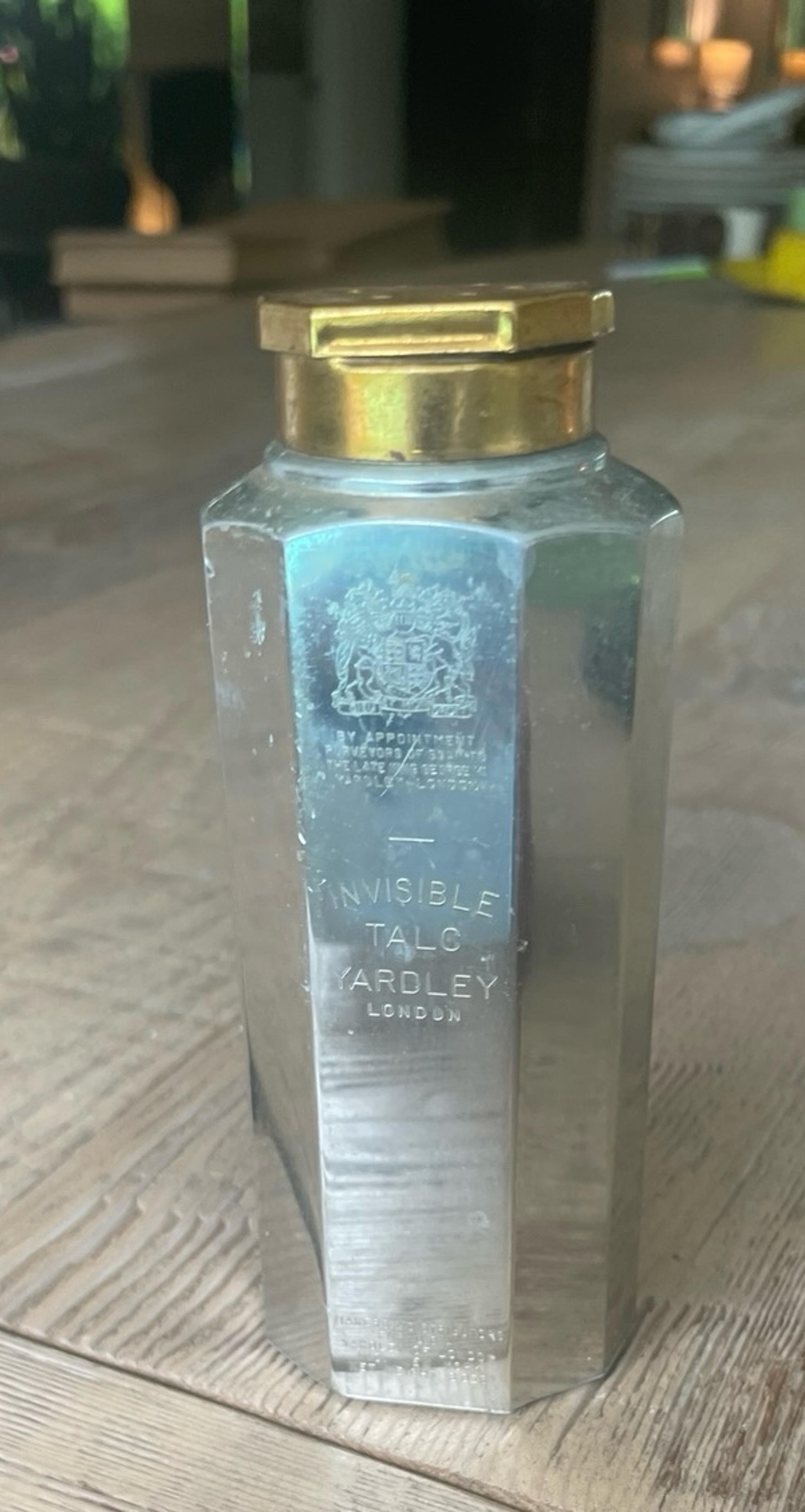 Vintage silver and gold talcum powder bottle. ‘Invisible Talc’, Yardley