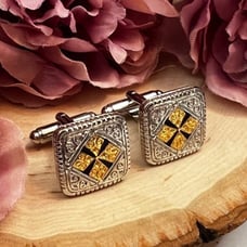 Elegant Silver and Gold Cufflinks with Black Patonce Cross