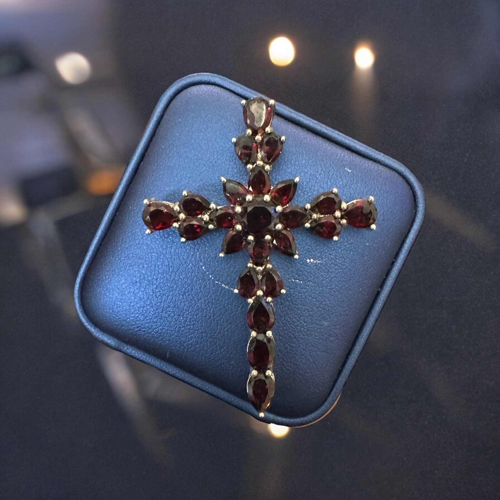 Sterling silver cross with garnet gemstones