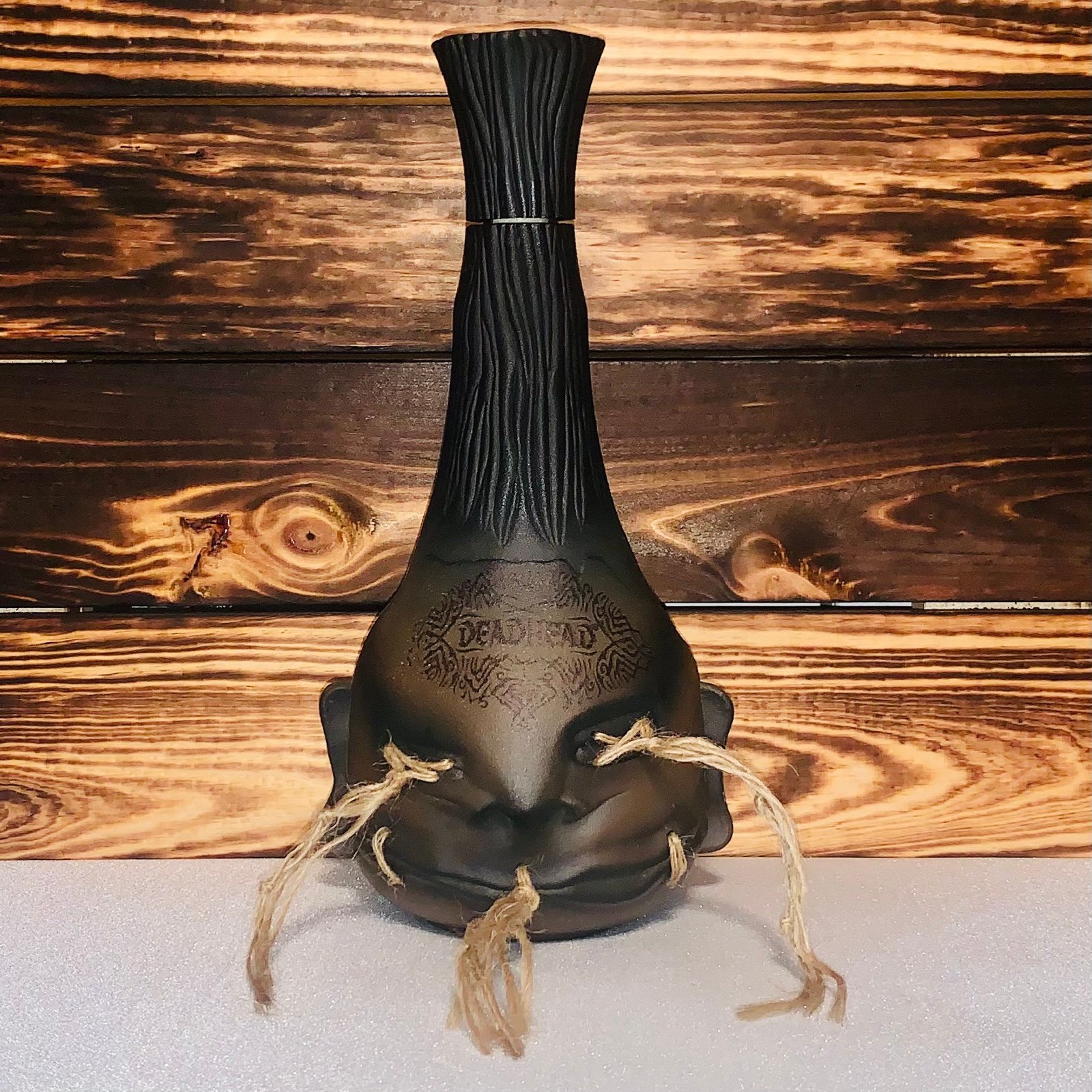 Deadhead rum tsantsa empty bottle tall shrunken head decanter