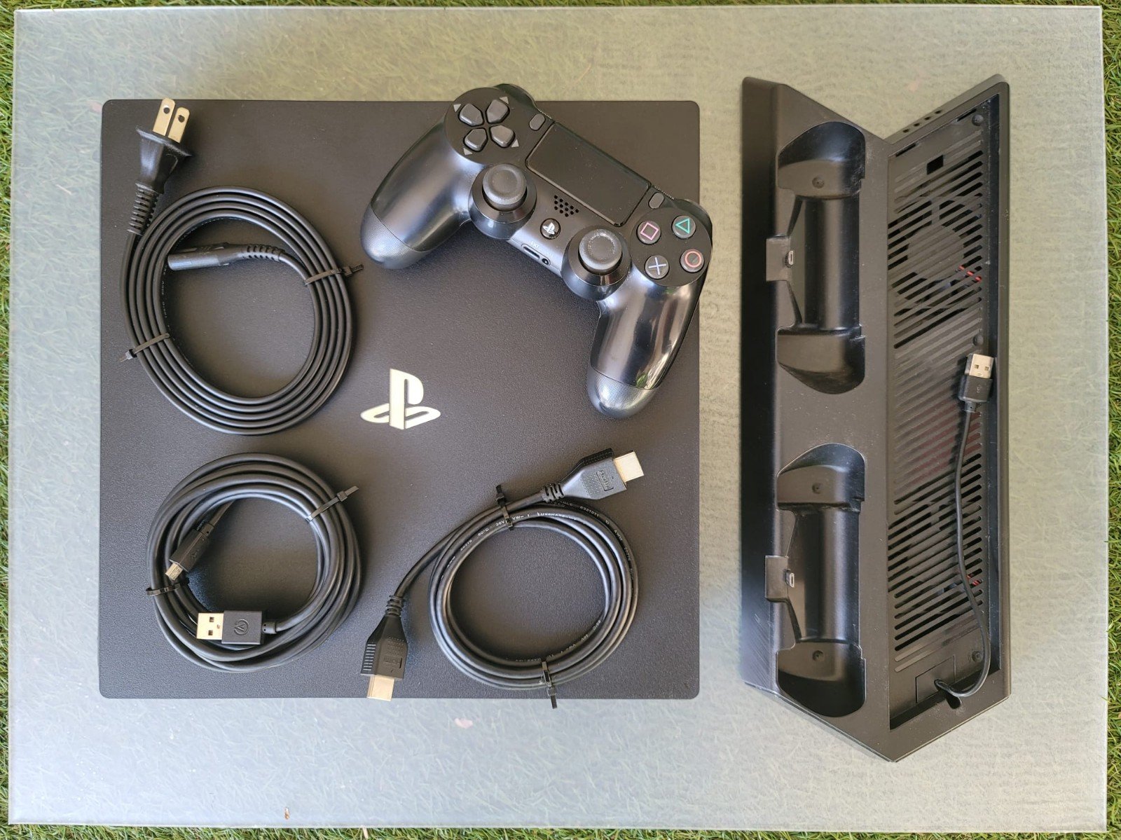 Playstation 4 Pro w/Cooling Station and Games