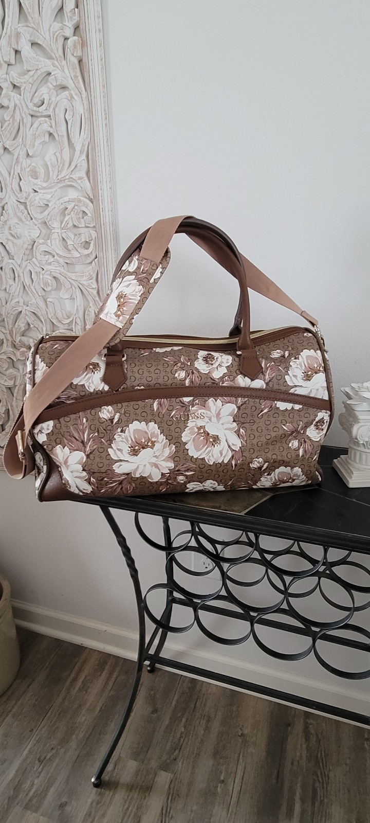 Guess Brown Floral Duffle Handbag with crossbows strap.