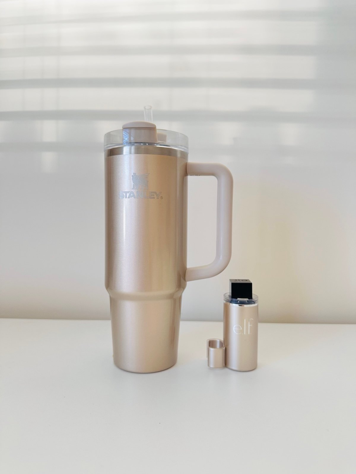 Stanley x Elf tumbler and lip oil holder