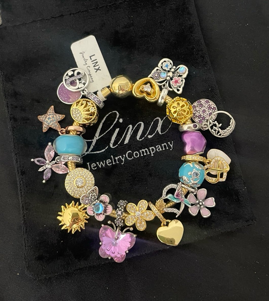 Linx Yellow Gold Bracelet with Pink Purple Blue and Gold Charms