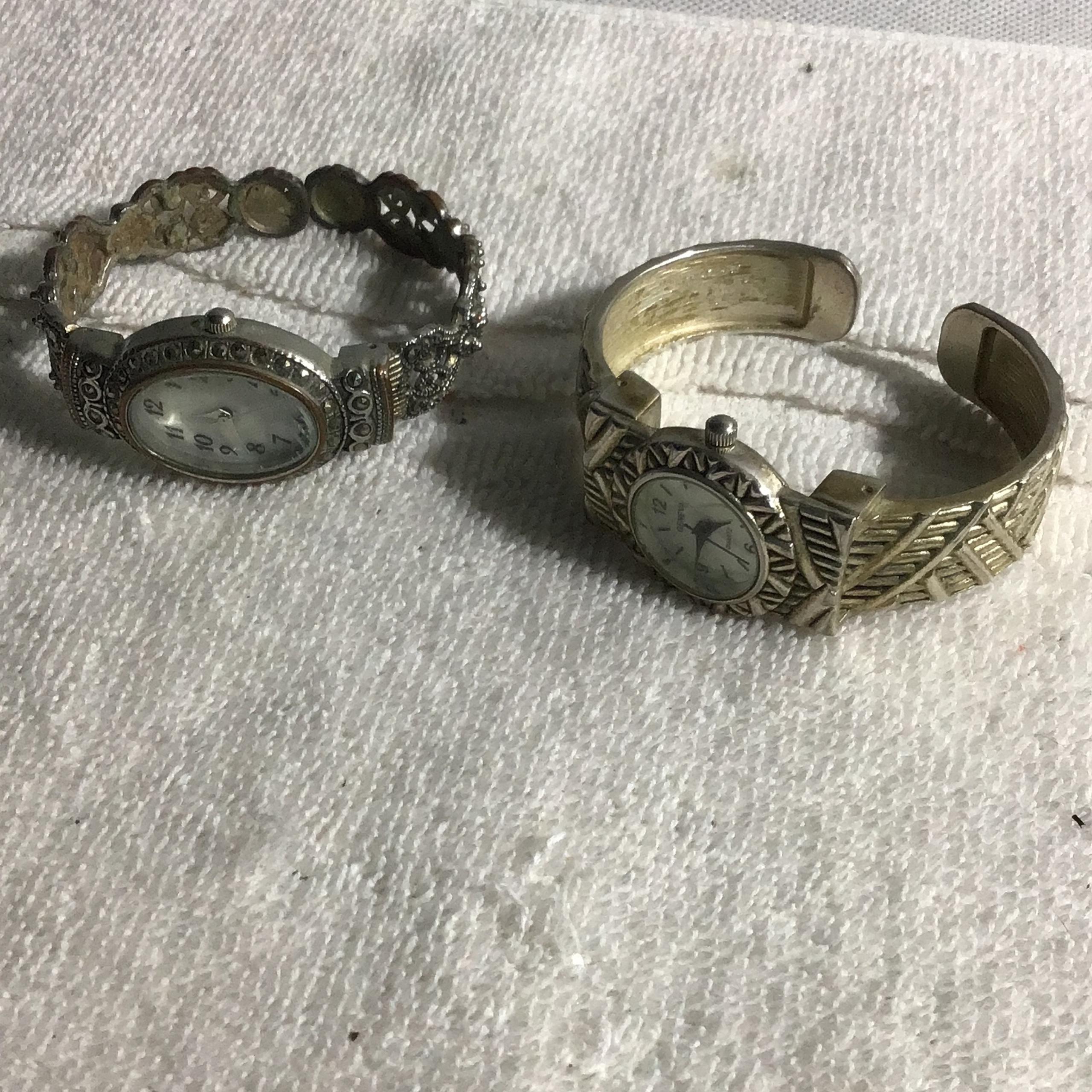 Two clip on bracelet watches. Need batteries fancy Sk09