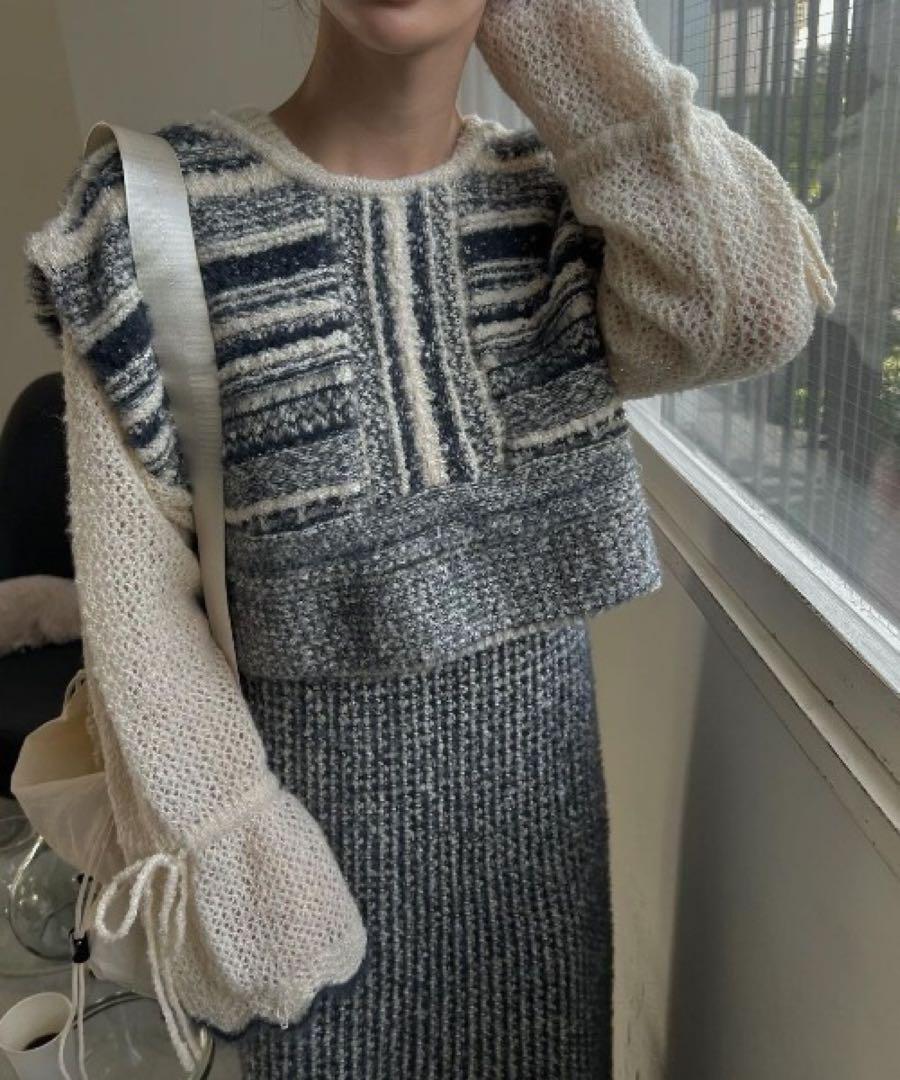A random, shaggy knit pattern with a geometric design.