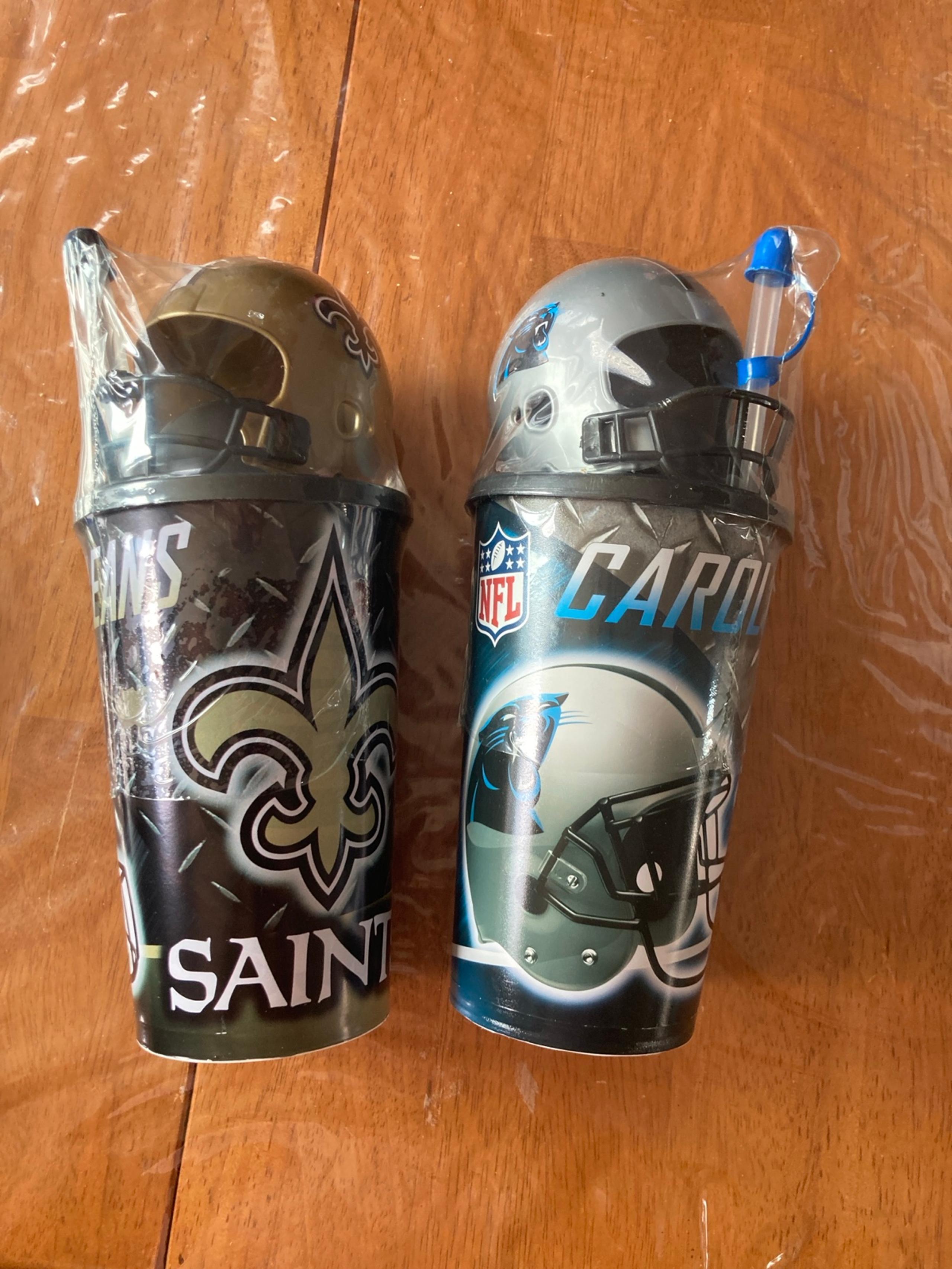 Carolina Panthers AND New Orleans Saints plastic cups.  with helmet and straw