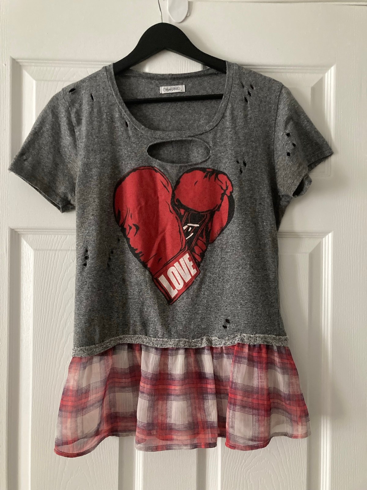 Lauren Moshi Up-cycled top with boxing gloves heart graphics and plaid trim.