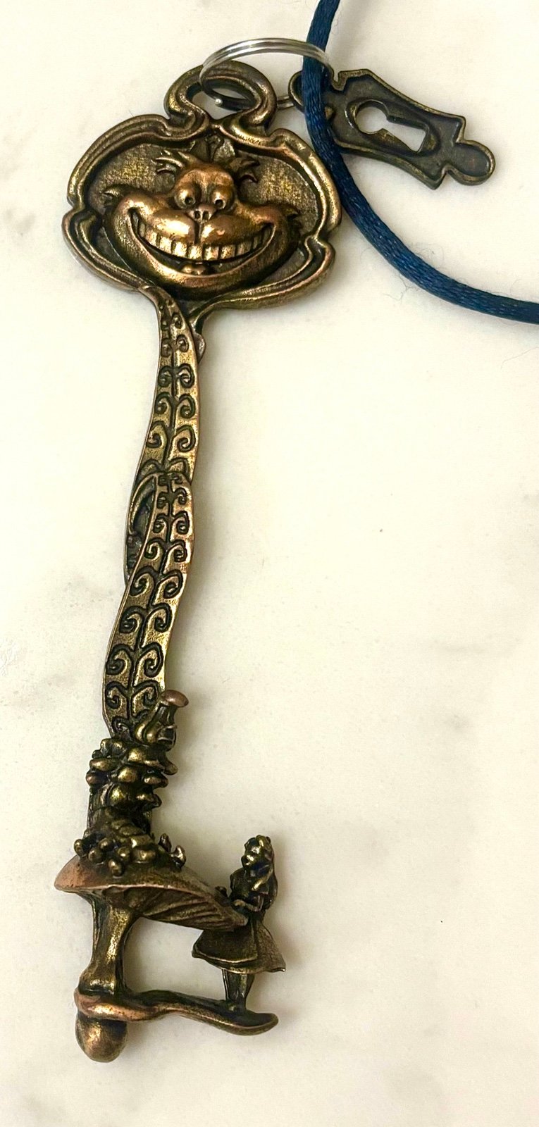 Vintage Alice in wonderland key from Disney land, highly detailed and decorative