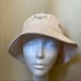 PRADA RE-EDITION BEIGE BUCKET HAT
