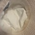 PRADA RE-EDITION BEIGE BUCKET HAT