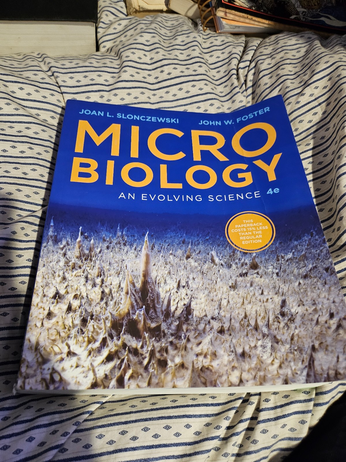 Microbiology and evolving science 4th edition