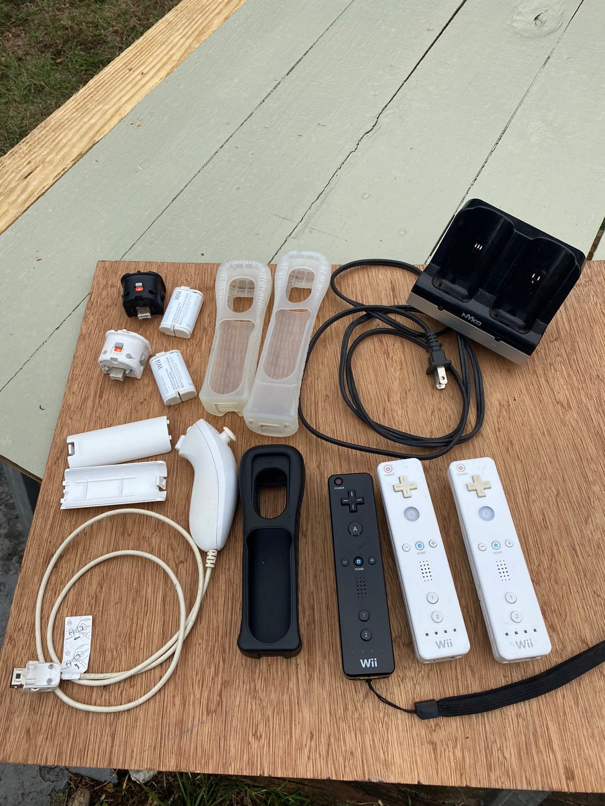 Nintendo wii remotes, charging dock and some misc