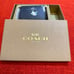 Coach small snap wallet with snowman print/silvertone hardware