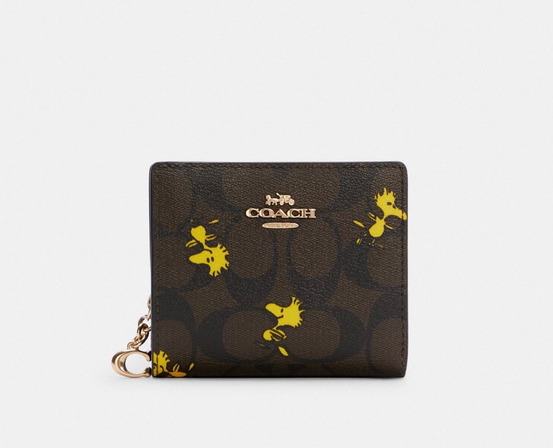 Coach X Peanuts Snap Wallet In Signature Canvas With Woodstock Print
