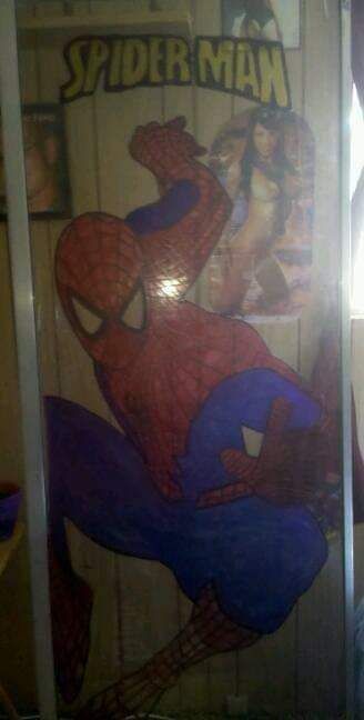 Engraved Spider-Man on a sliding glass d