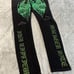 Mackeen Mens Black Flat Front Chrome Green Stud Distress Jeans Pant Size 38 NWT