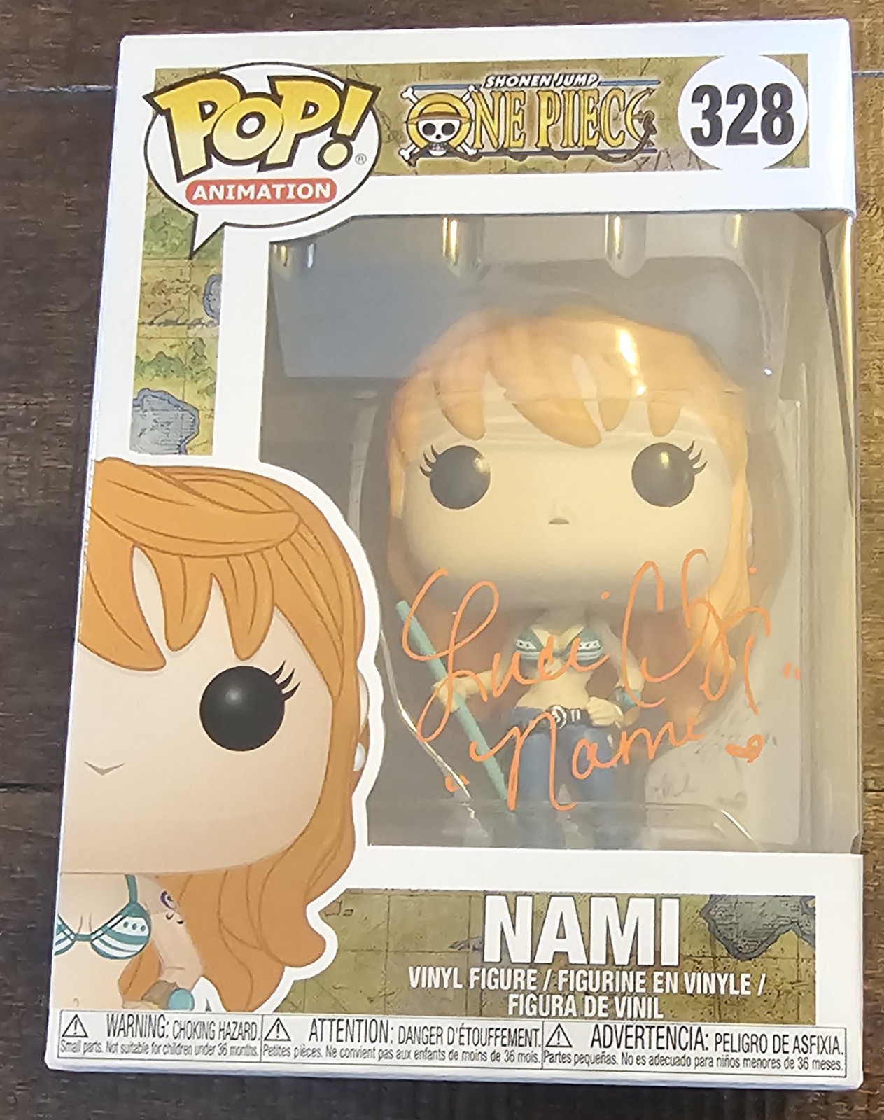 Luci Christian signed Nami One Piece Funko Pop #328 with Nami inscription.
