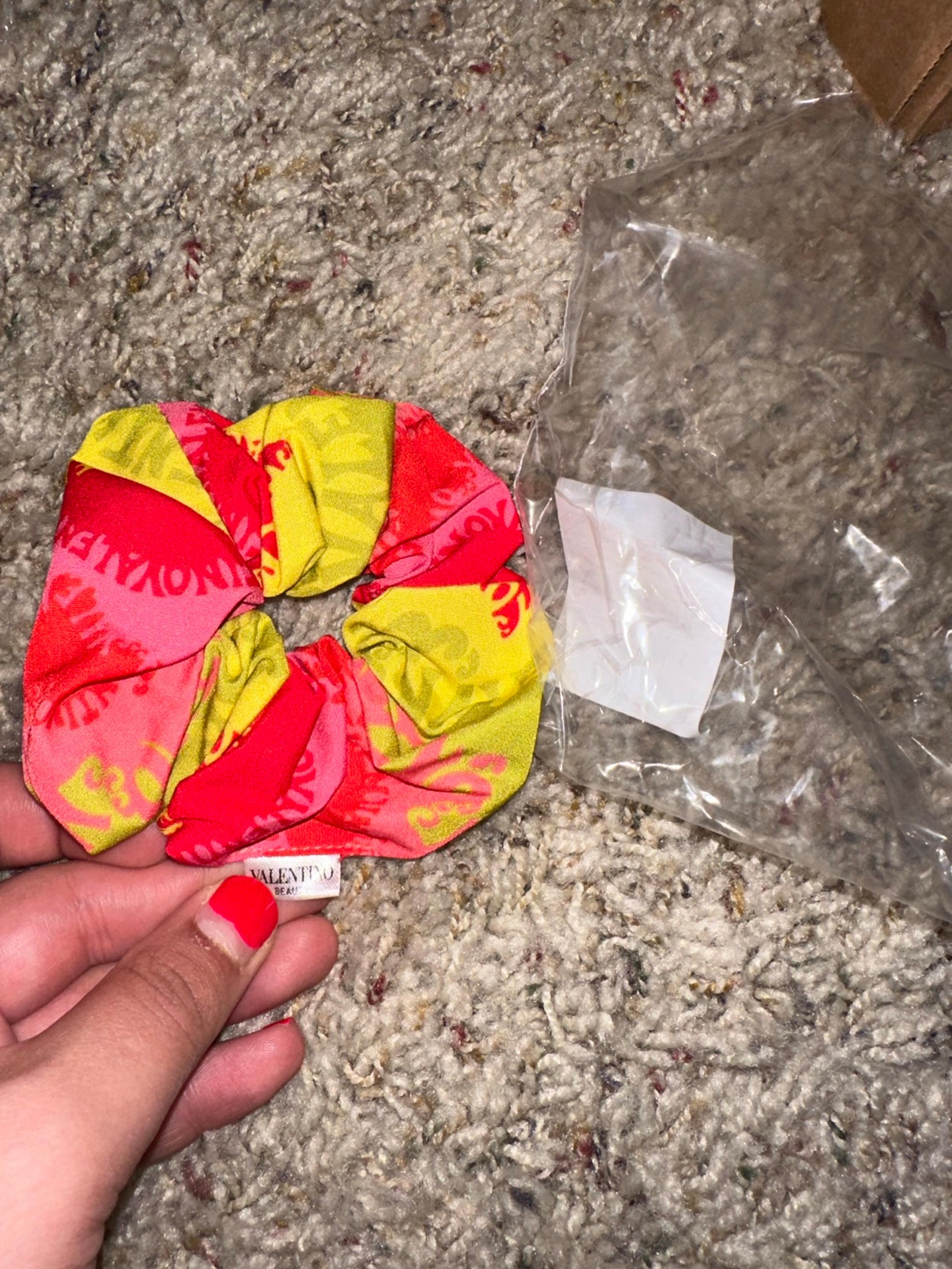 Yellow and red hair tie Valentino beauty brand