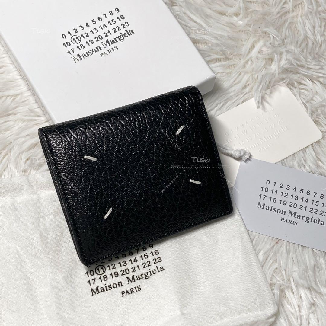 Brand new, unused Maison Margiela two-fold wallet.