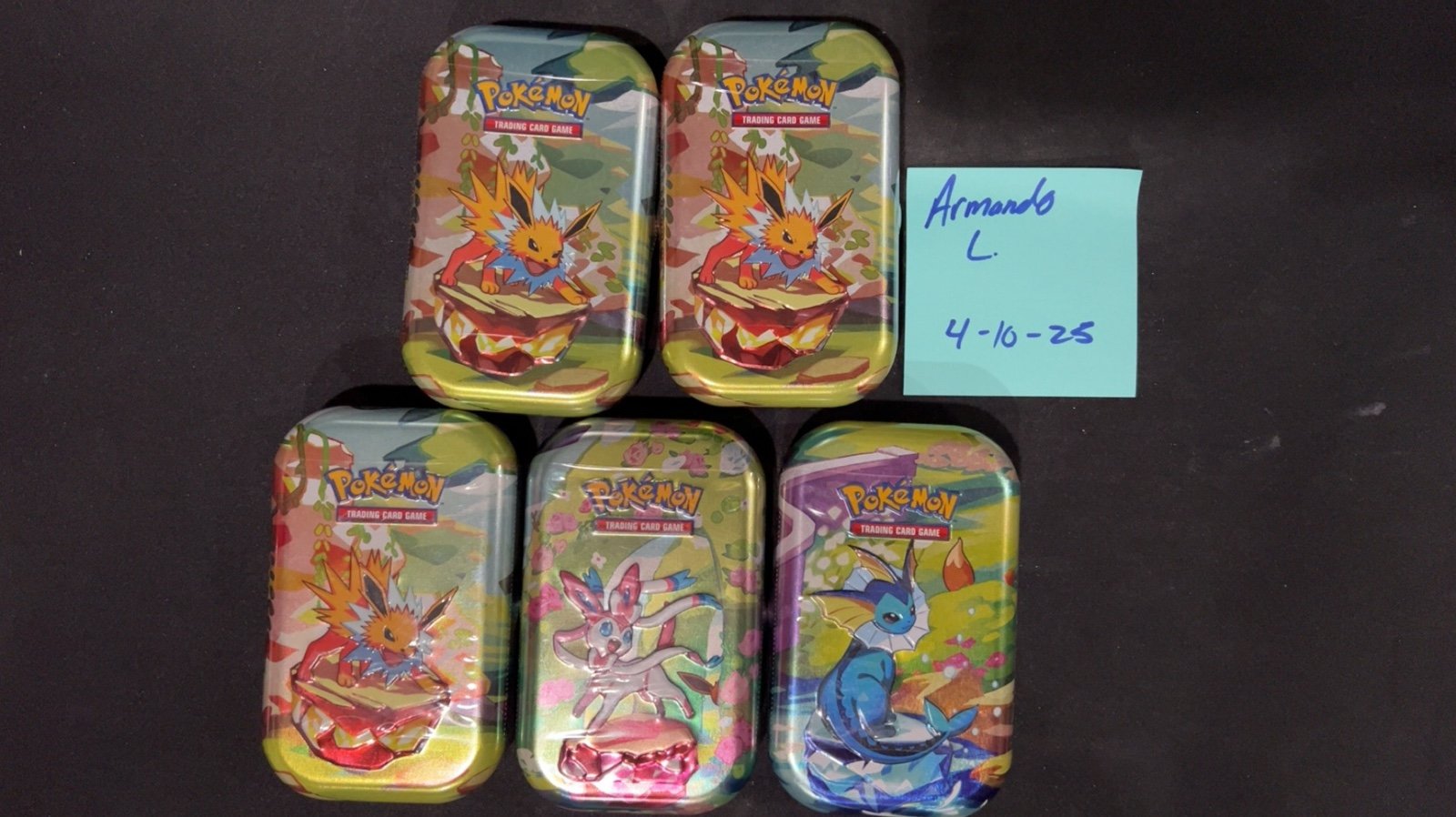 5 Pokemon Prismatic Evolutions tins