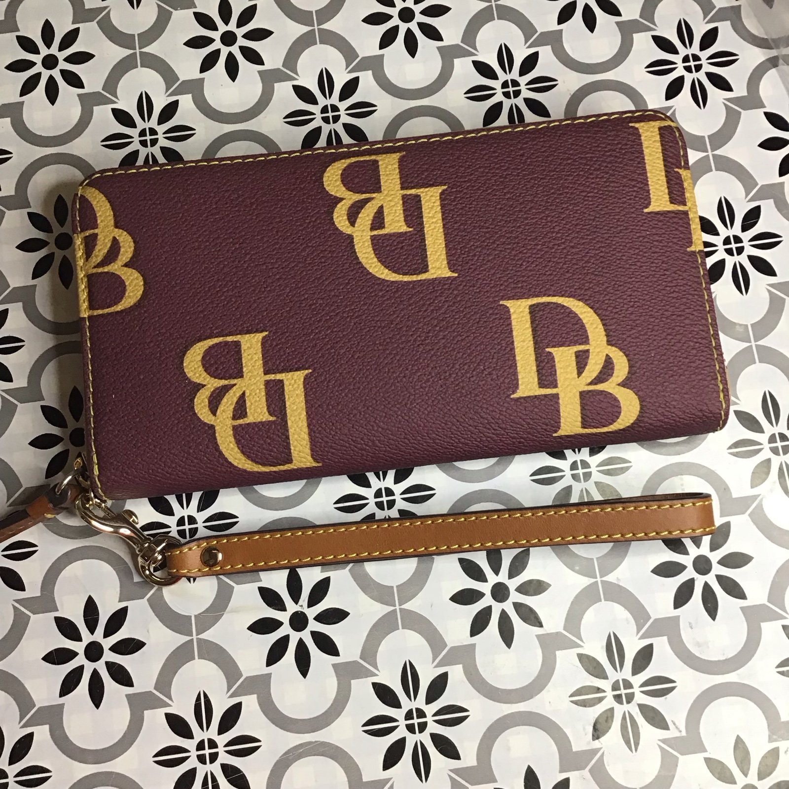 Dooney monogram large wristlet wallet in wine