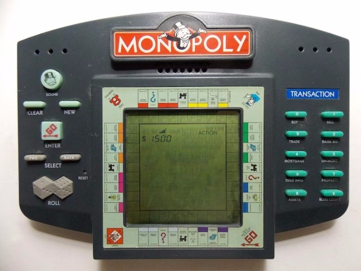 Monopoly Hand Held Electronic Game Video Board Game