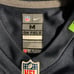 Tariq Woolen unused authentic with tags Jersey. Size youth medium #27 Seahawks.