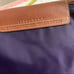 purple nylon and leather tote bag