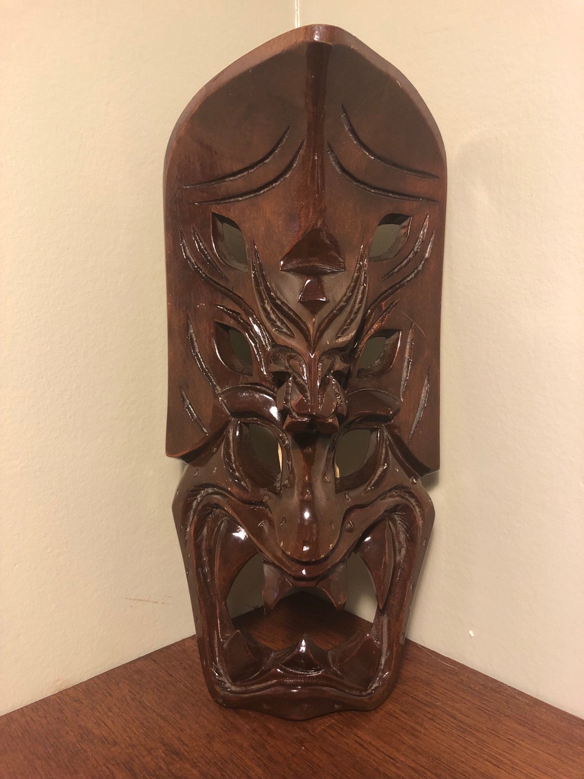 Tiki style carved face wall hanging