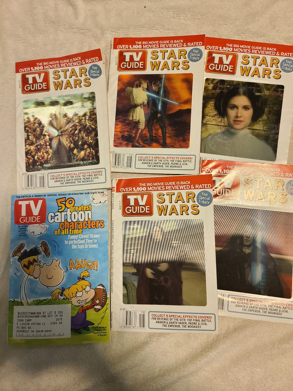 Lot of TV guides star wars and one other