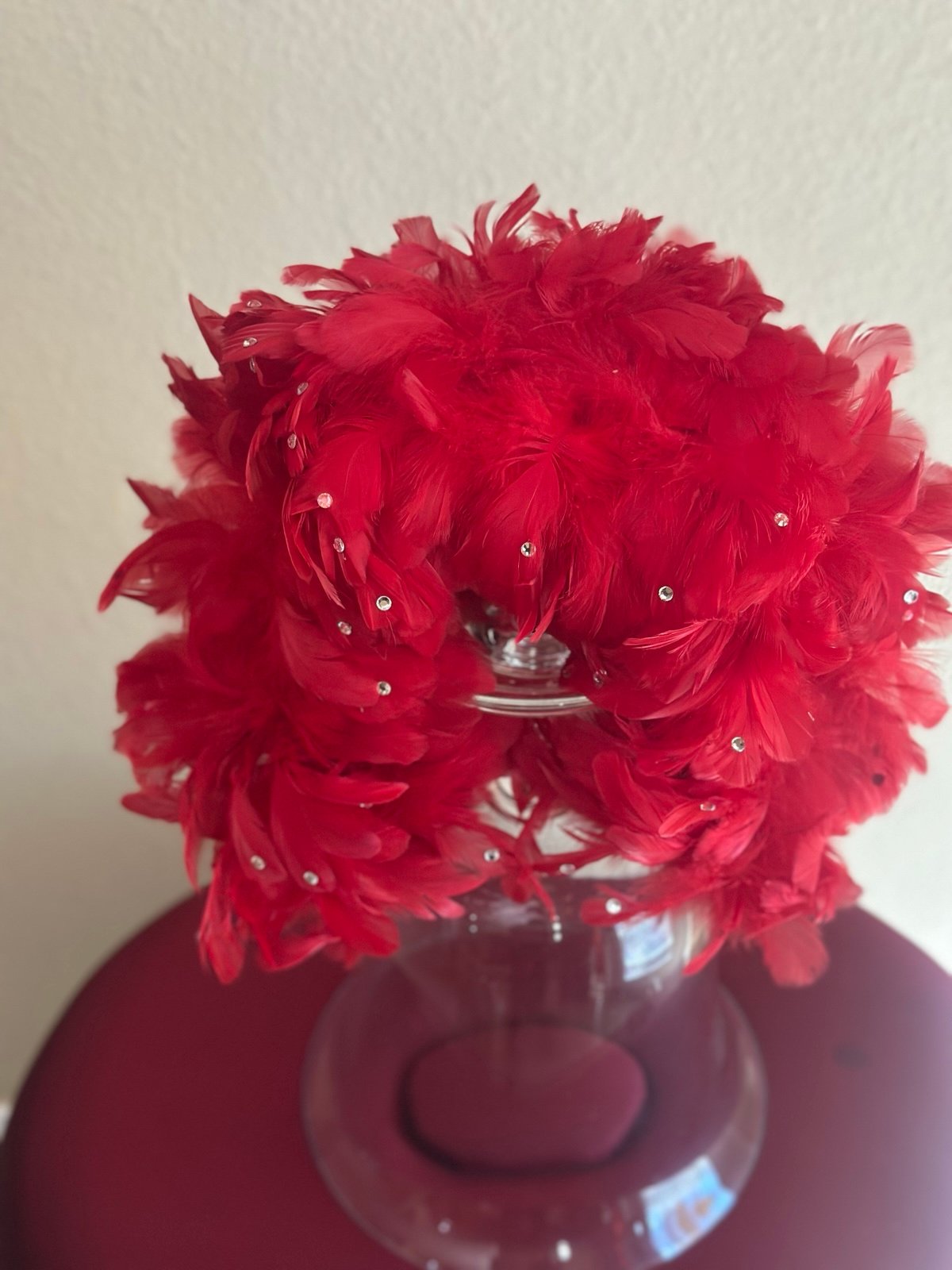 Vibrant red feather headband with front scattered rhinestones