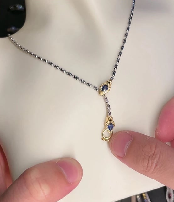 Elegant Gold and Silver Necklace with Blue Accents