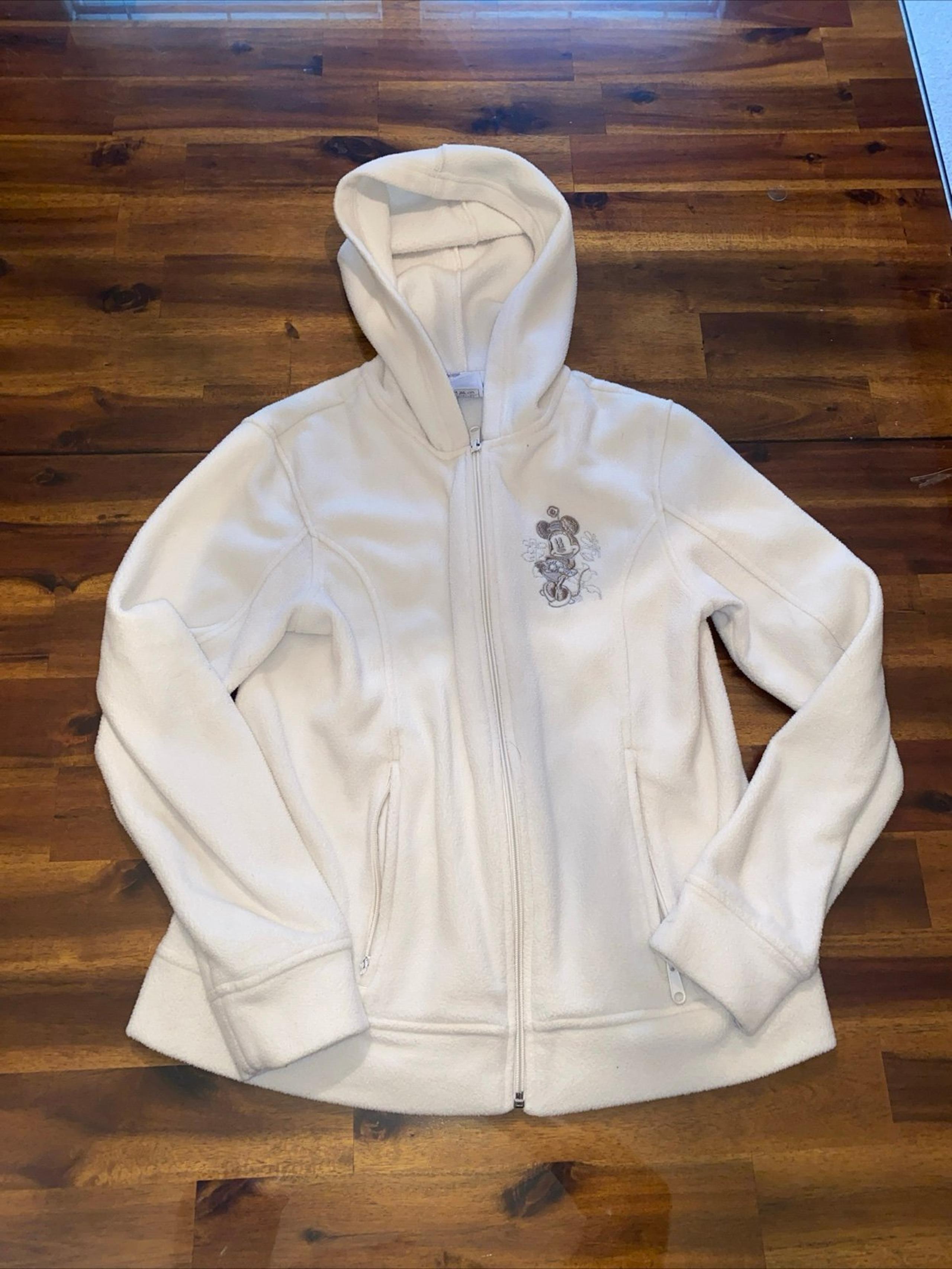 Disney women’s fleece sweater Size S Minnie Ivory Zipper Pockets Embroidered.