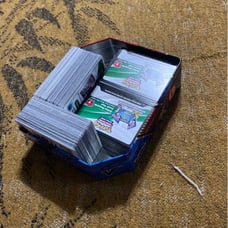 Pokemon tin with cards
