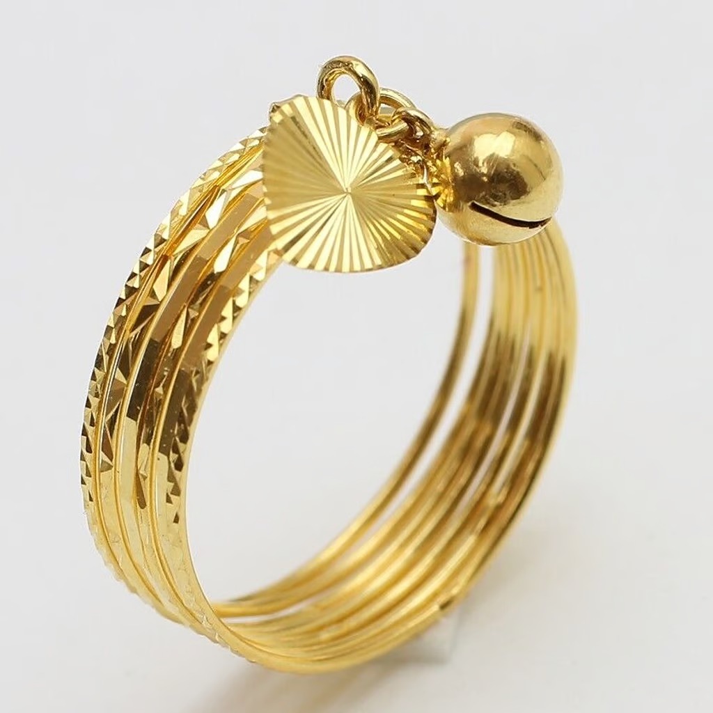 18k gold 7 days ring with bell/ heart  ( size 7 )