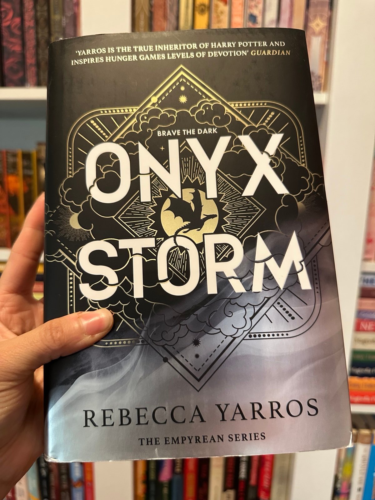 Waterstones Exclusive Onyx Storm with sprayed edges and character art UK edition