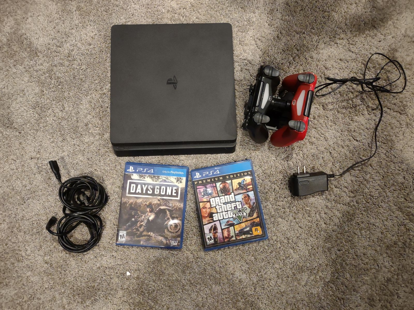 Playstation 4 included with two remotes and charging station with HDMI cords and