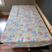 Floral print table cloth, napkins, napkin rings, 2 solid teal placemats