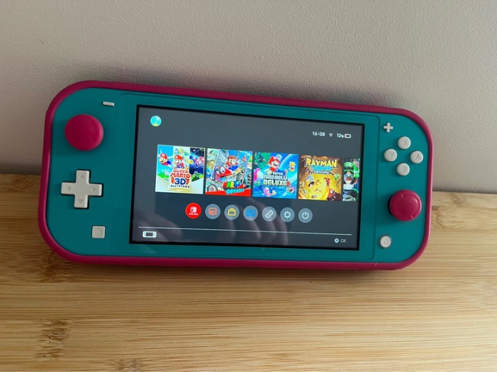 Nintendo switch light with case and two games