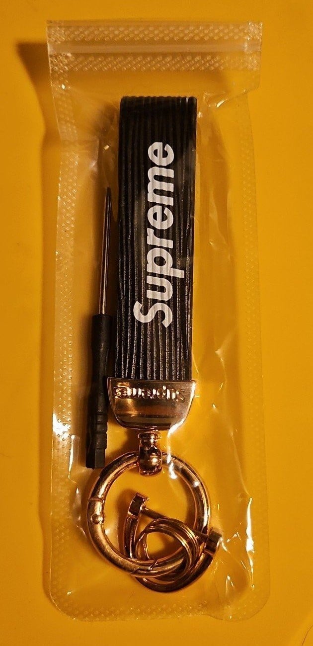 Supreme black and gold key chain with scew driver