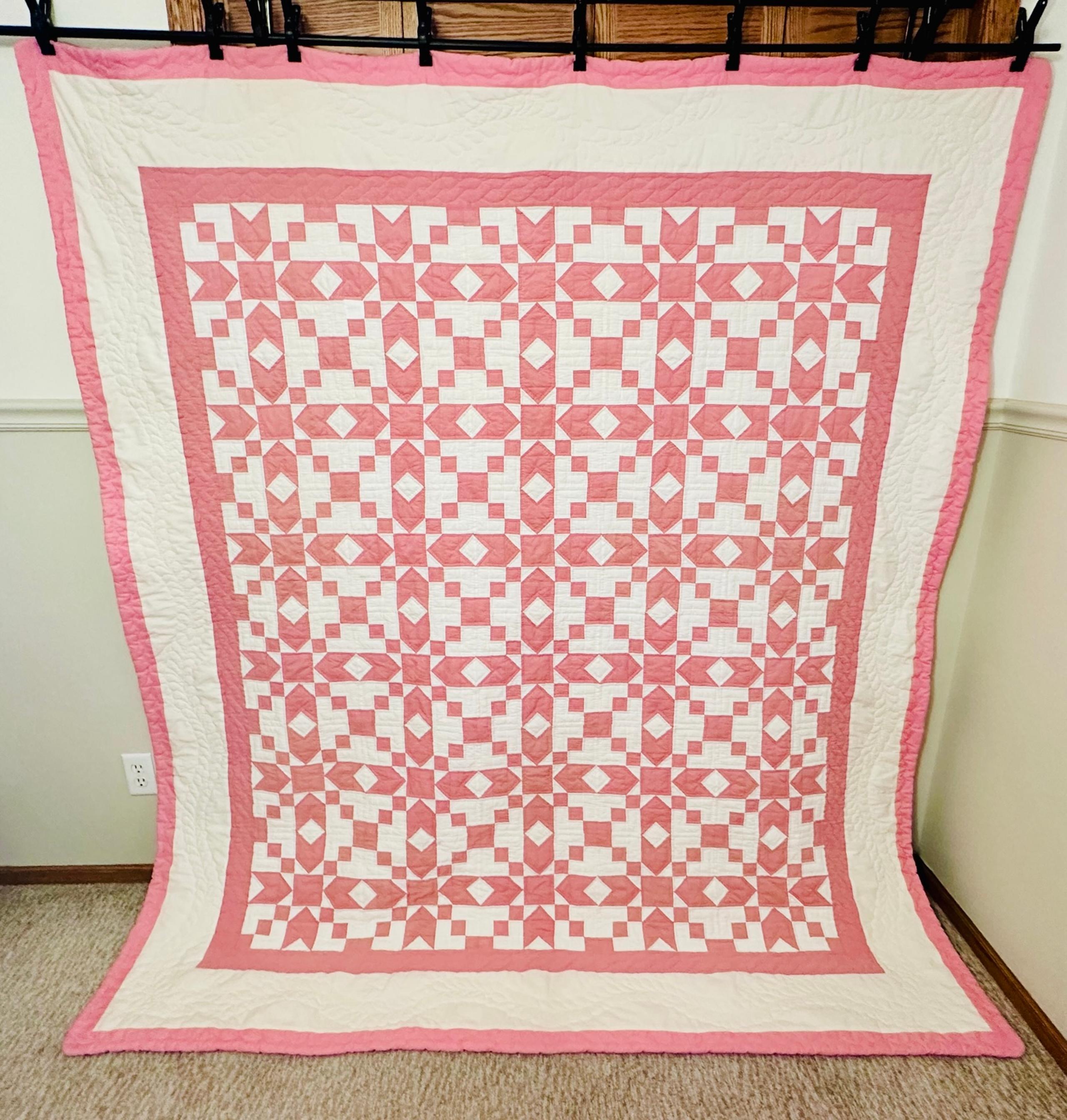 Handmade pink and cream quilt