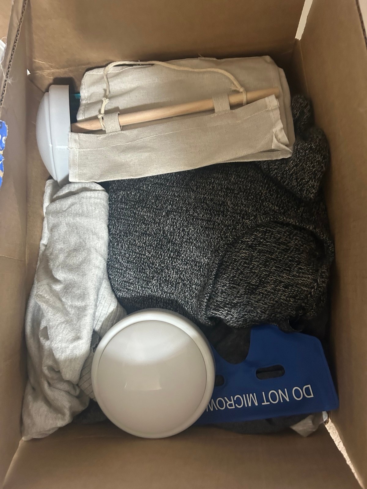 Box of size large and XL women’s clothes and a few other items