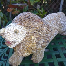 Vintage shell covered lion figure