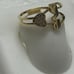 14 k solid yellow gold ring with white CZ