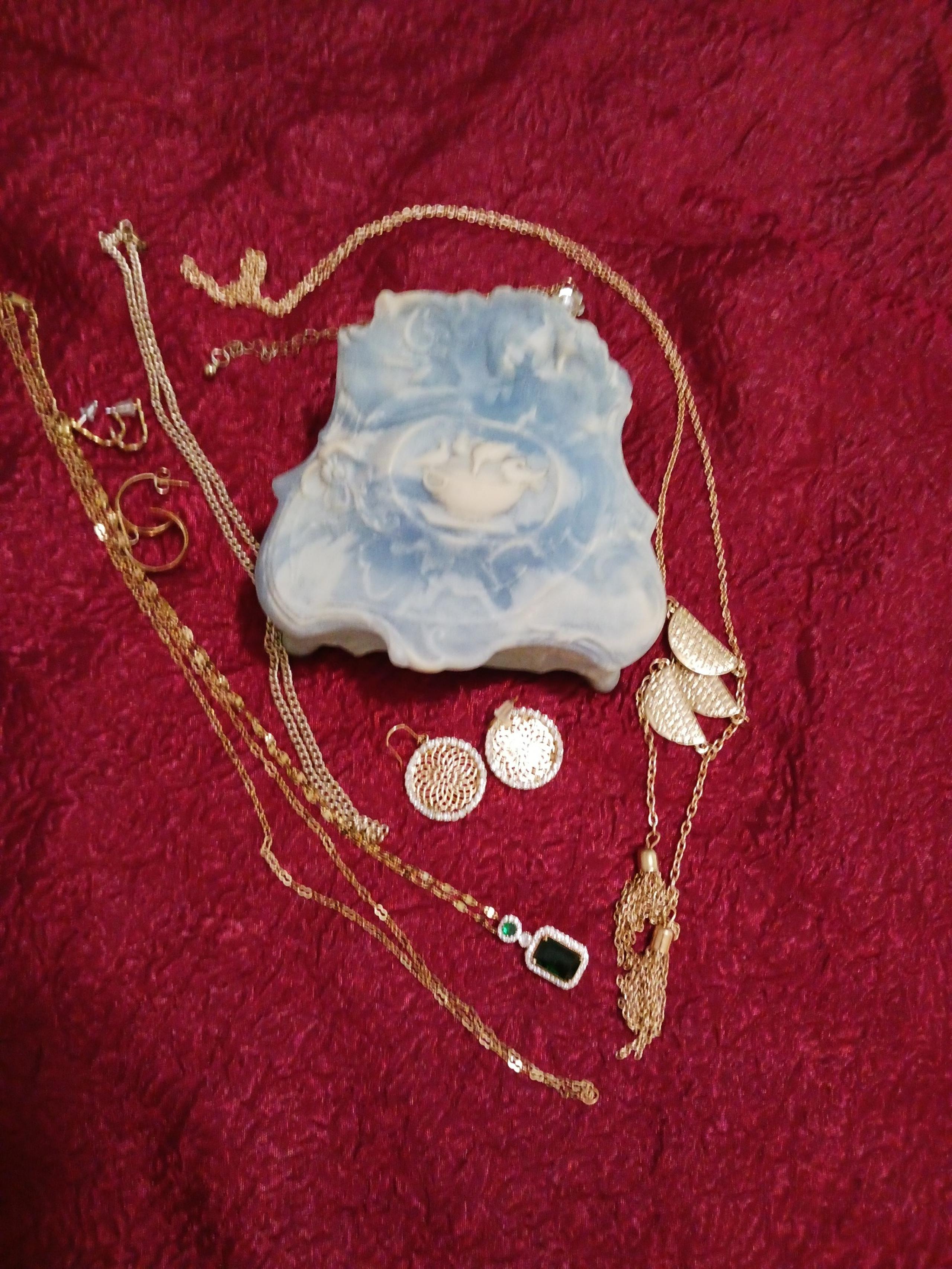 Carved stone jewelry box with jewelry
