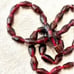 Strand of 7x3mm bicone Garnet beads 14in. 72 84