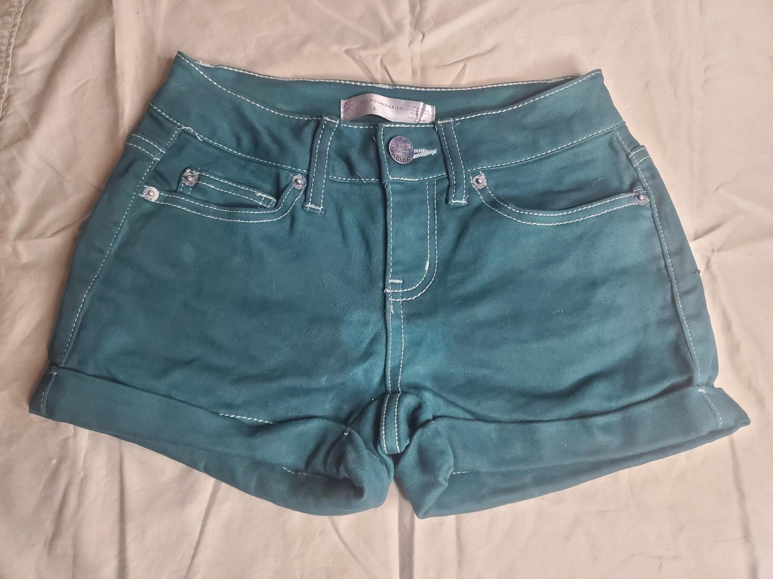 No Boundaries mid rise dark green dyed shorts.